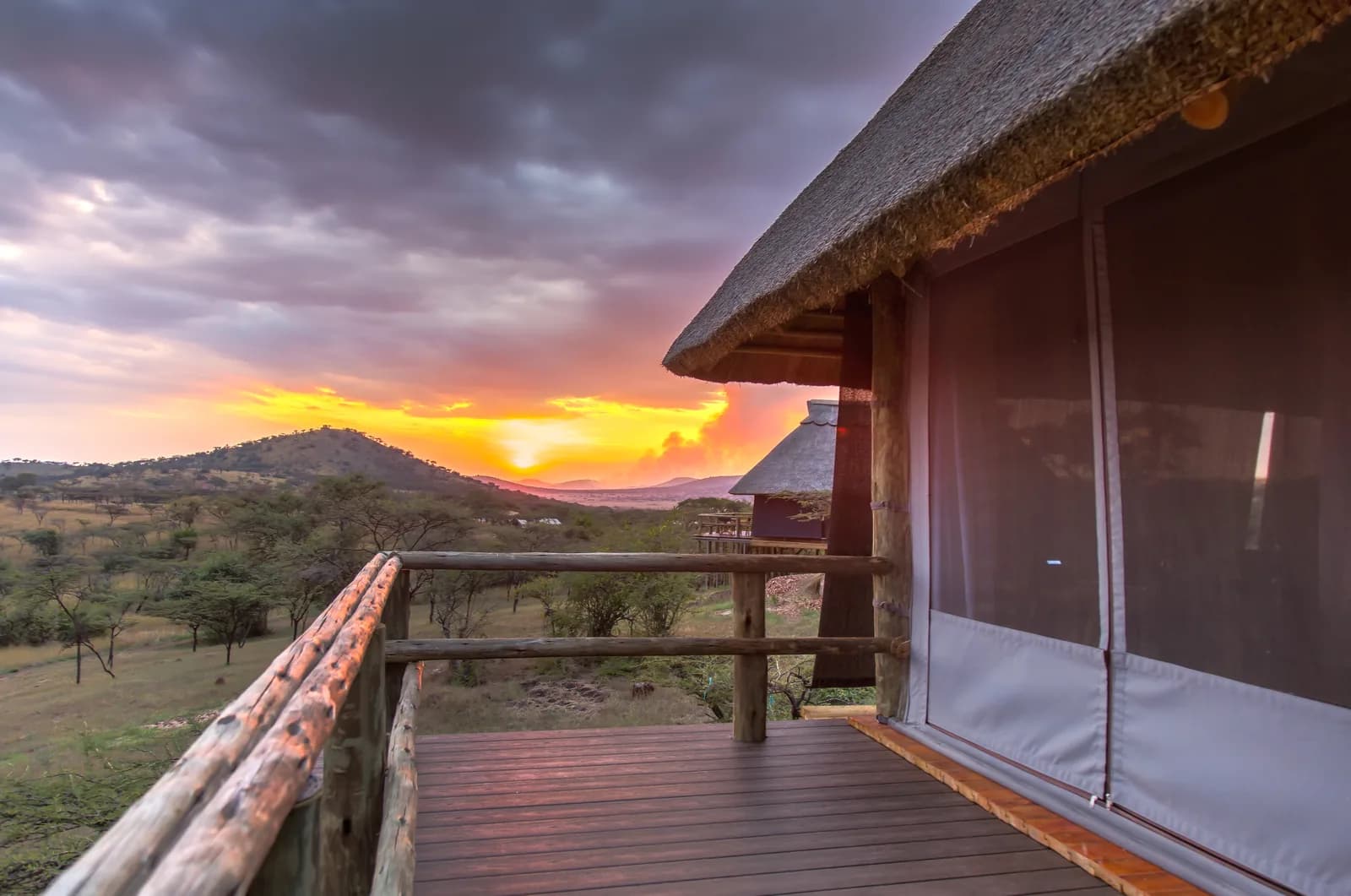 Room balcony at sunset, with hills on the horizon