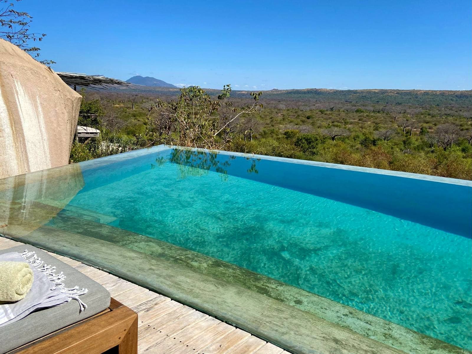 Private deck and pool at an exclusive-use property overlooking wilderness