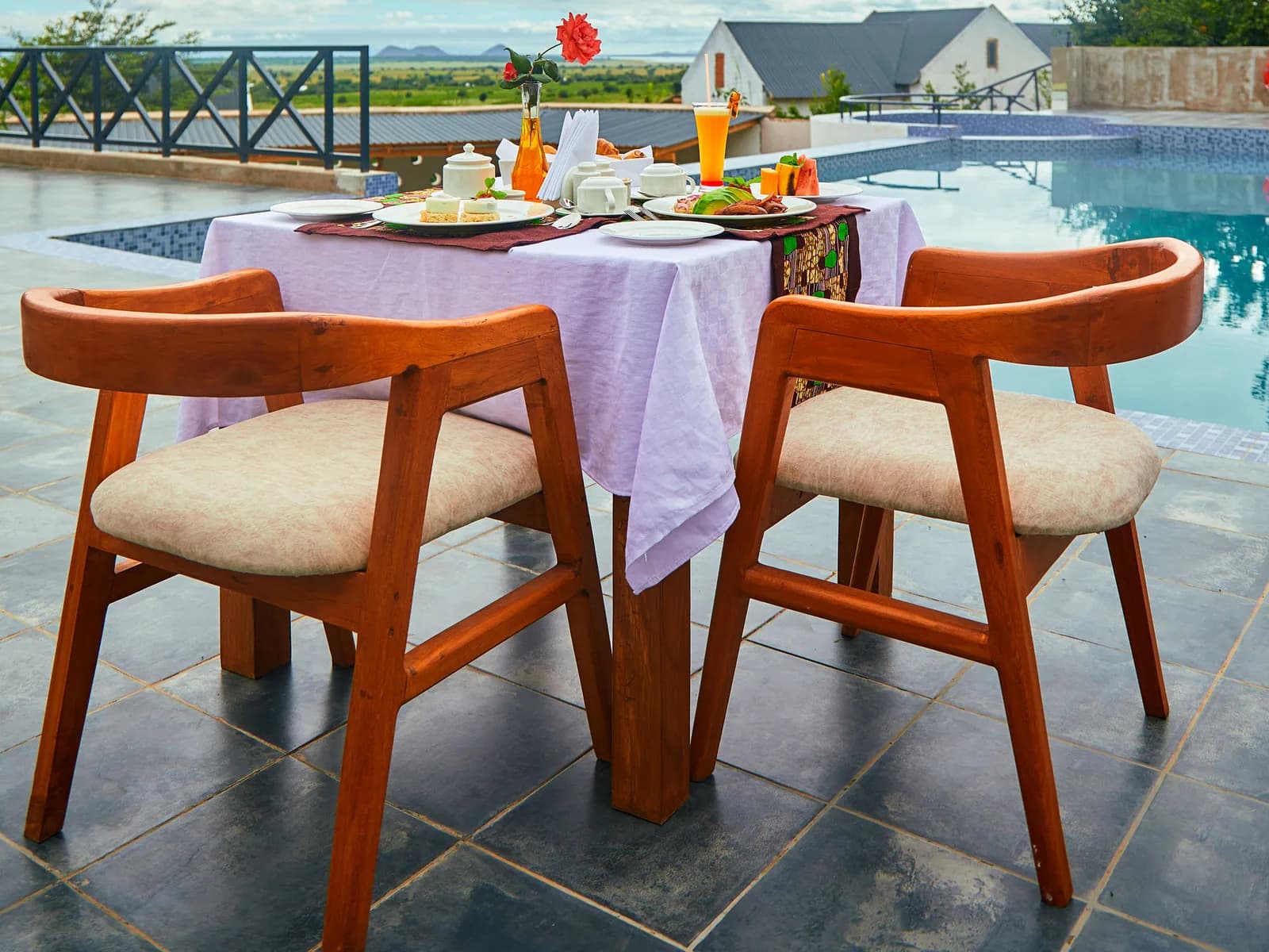 Breakfast table for two beside the pool